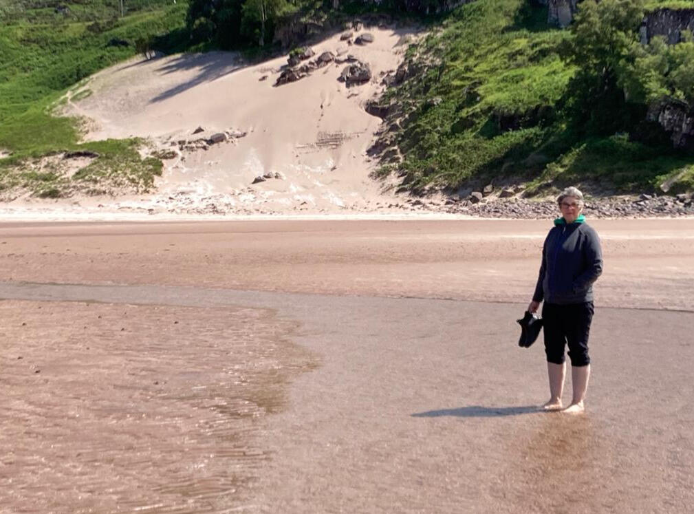 Here I&#39;m doing my favourite thing... having a paddle in the sea!